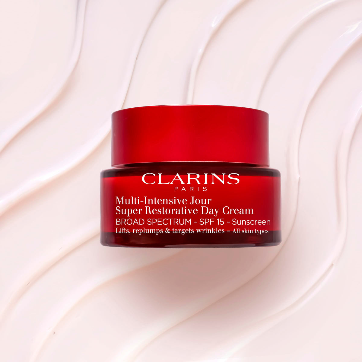 Clarins cream on hand demonstration showing spreadability and quick absorption benefit