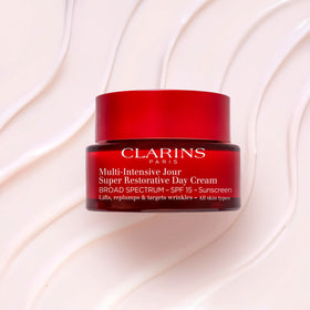 Clarins cream on hand demonstration showing spreadability and quick absorption benefit