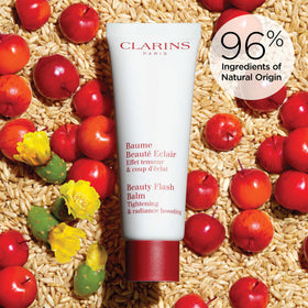 Clarins ingredient shot with organic acerola, emphasizes natural-origin brightening
