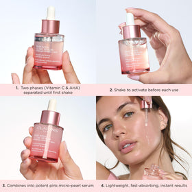 Clarins bottle in hand for scale to show one fluid ounce travel-friendly size