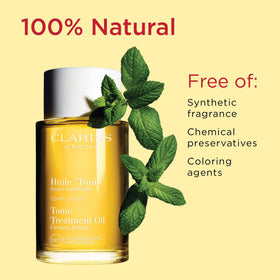 CLARINS bottle beside hazelnuts highlighting natural extracts and nourishing benefit