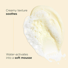 Clarins cleanser dispensed in hand demonstrating easy application and mild foam