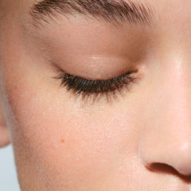 Clarins micellar water on cotton pad texture illustrating gentle removal