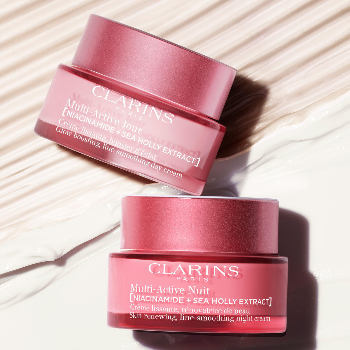Clarins cream on fingers ready to apply, demonstrating spreadability and hydration