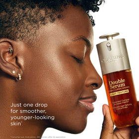 Clarins bottle on vanity with minimal styling showing everyday skincare routine