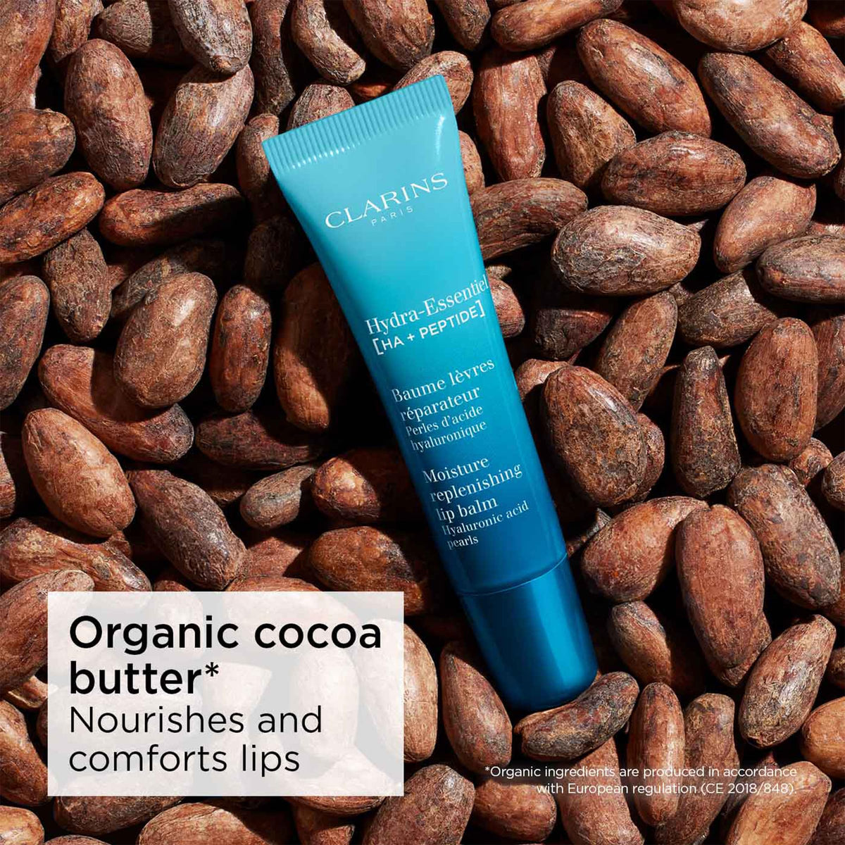 Clarins Hydra‑Essentiel next to a coin showing 0.5 ounce size for travel convenience