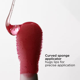 CLARINS bottle on bedside table to suggest overnight lip care and restorative comfort