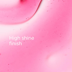 CLARINS texture drop on fingertip highlighting lightweight oil and rich gloss for instant shine