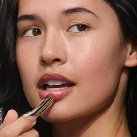 Clarins lip oil balm botanical oils displayed emphasizing natural moisturizing benefits