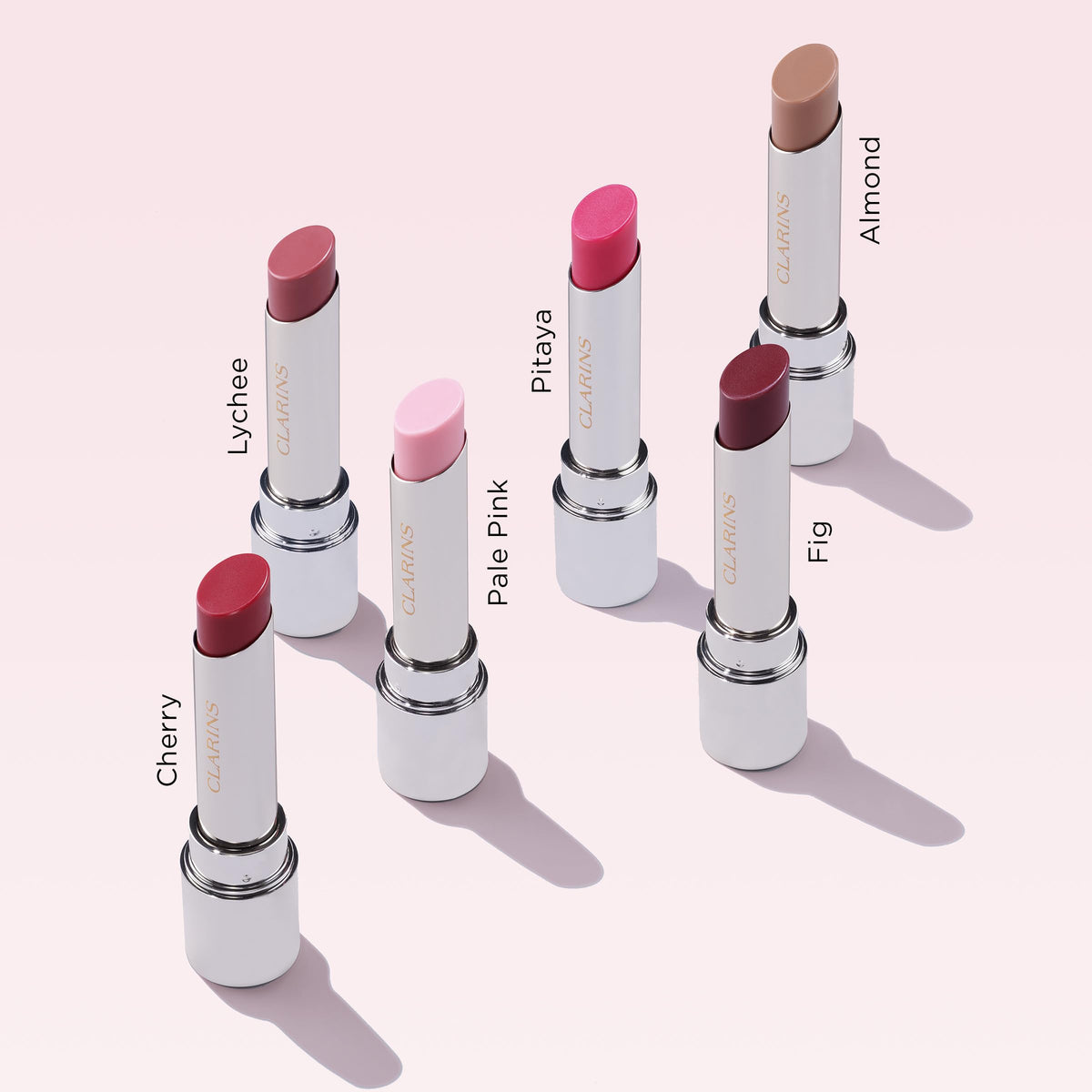 Clarins lip oil balm lifestyle bag shot showing convenience for touch-ups