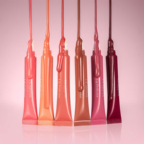 Clarins gloss inside a purse suggesting everyday hydration on-the-go