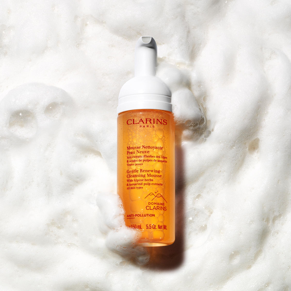 Clarins mousse beside ruler showing 5.5 oz size for travel and daily use