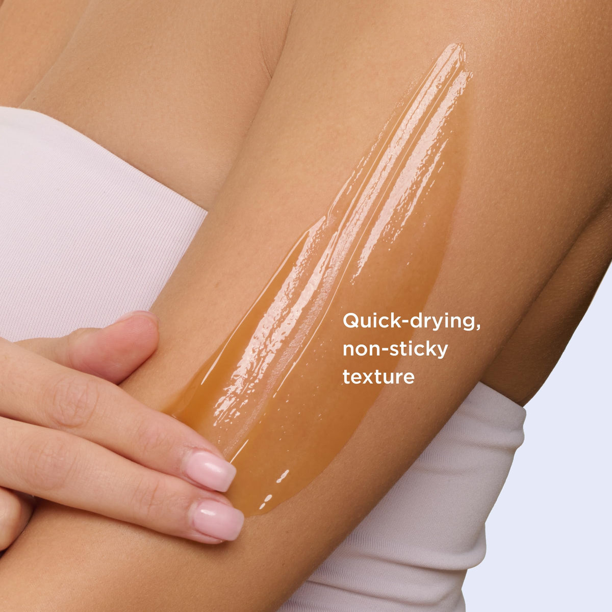 Clarins product in hand showing 4.5 ounce size and travel-friendly scale