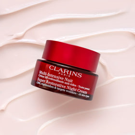 Clarins product being smoothed on hand demonstrating hydration benefits