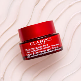 Clarins Super Restorative Harungana extract display highlighting natural active support