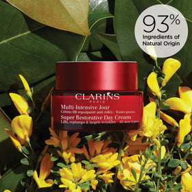 Clarins Super Restorative size shown in hand to indicate jar scale and easy dispensing