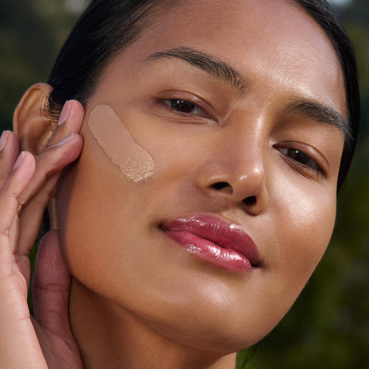 Clarins application on skin demonstrating sheer medium tint and natural-looking coverage