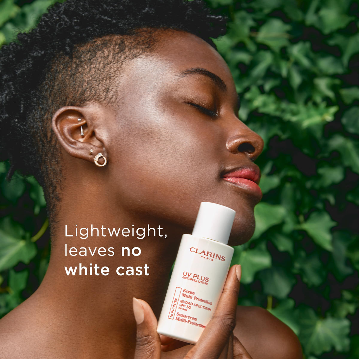 Clarins applying product to face for smooth non-greasy finish