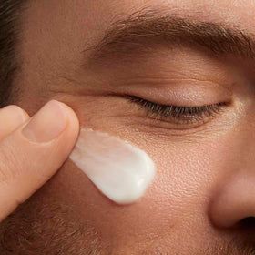 CLARINS cream on fingertip demonstrating lightweight feel and easy spread