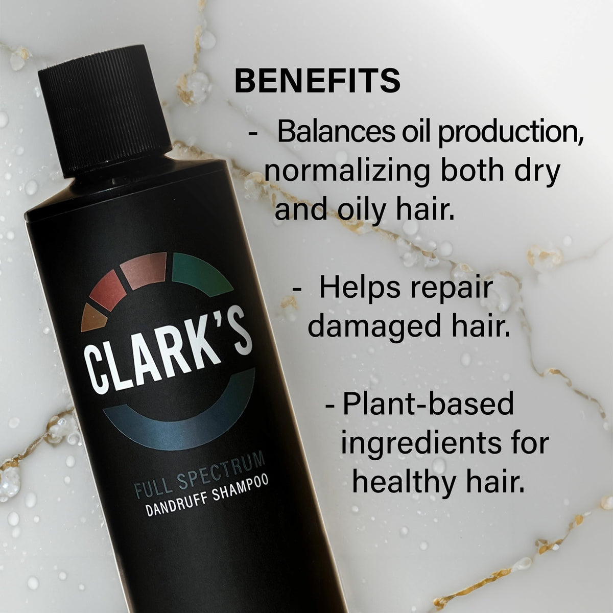 Clark's 8 fl oz bottle held in hand showing product size and portability