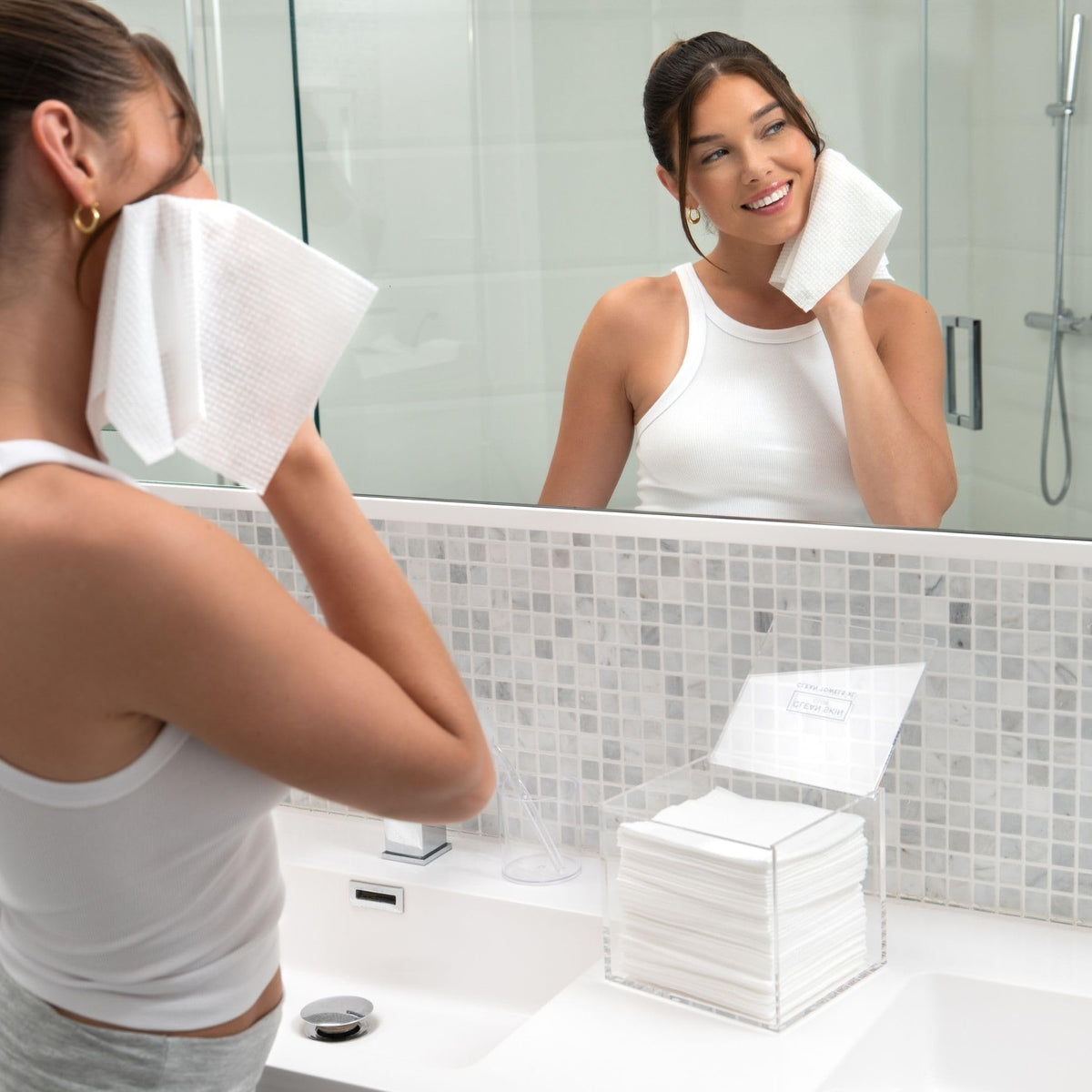 CLEAN SKIN CLUB on bathroom vanity displaying stylish storage benefit