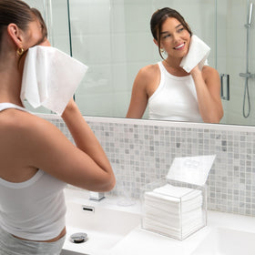 CLEAN SKIN CLUB on bathroom vanity displaying stylish storage benefit