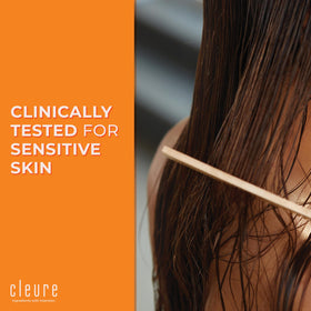 Cleure conditioner applied to hair in hand to show slip and detangling