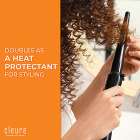 Cleure being sprayed on wet hair to detangle and reduce frizz