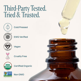 Cliganic argan oil on fingertips for face and skin hydration and gentle nourishment