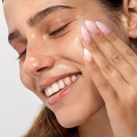 Cliganic cleanser foaming lightly in palm for effective removal