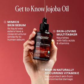 Cliganic jojoba oil being applied to hair ends to show smoothing and conditioning benefit