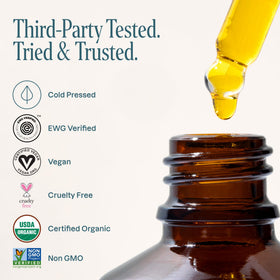 Cliganic oil smoothed into hair ends to reduce frizz and add shine benefit