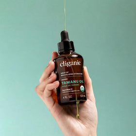 Cliganic tamanu oil on bathroom shelf showing natural routine integration