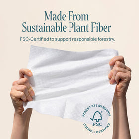 Cliganic towel in hand illustrating XL size and full-face coverage