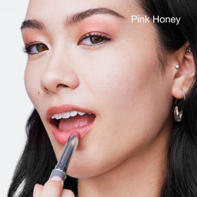 Clinique Almost Lipstick Pink Honey applied on lips showing sheer pink natural look