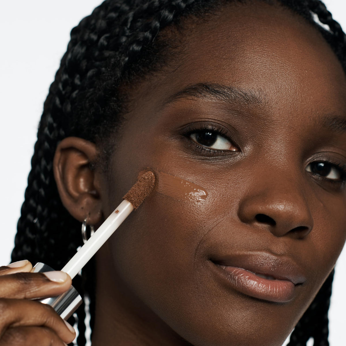Clinique application with sponges demonstrating buildable, even coverage