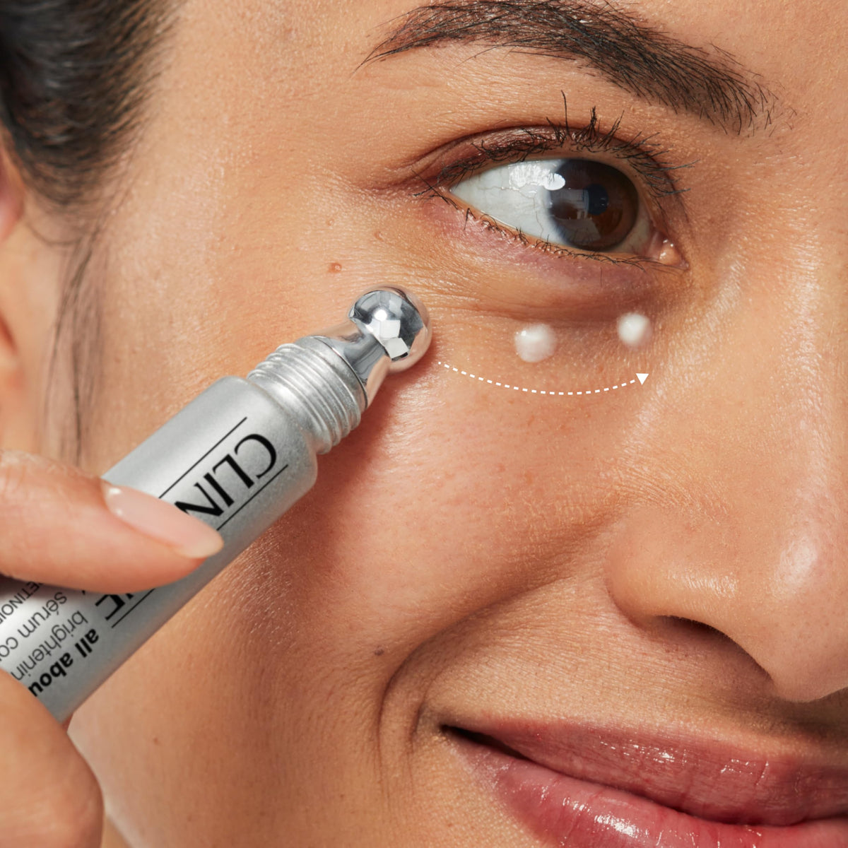 Clinique metal applicator close-up delivering precise, cooling under-eye massage