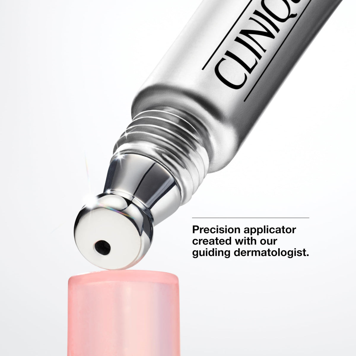 Clinique tube next to common items for scale to show travel-friendly size