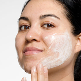 Clinique clarifying lotion bottle detail illustrating exfoliating, pore-refining benefit