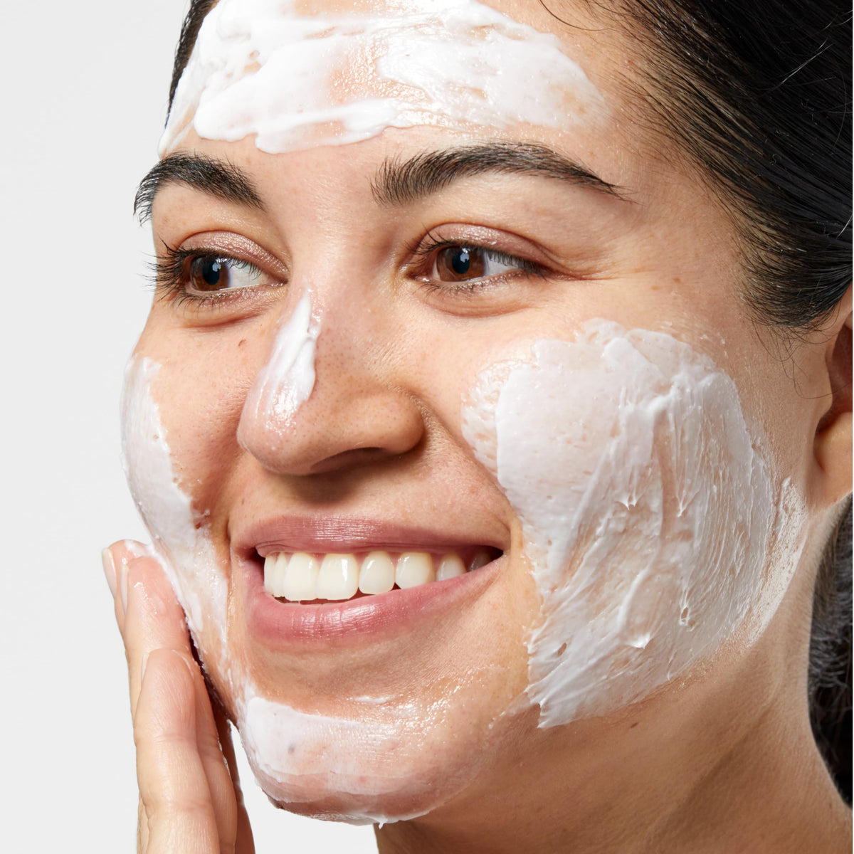 Clinique exfoliator in hand demonstrating ease of application and control