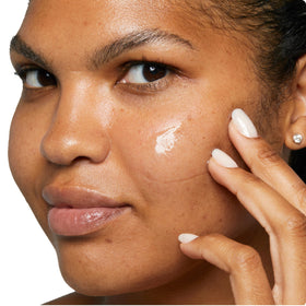 Clinique label close-up featuring Clean Shield ingredients for barrier support