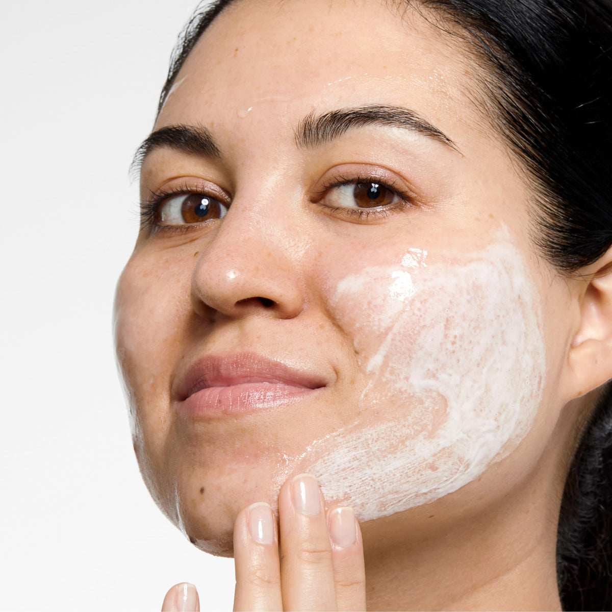Clinique liquid being poured to show quick-rinsing formula and simple application benefit