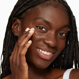 Clinique serum applied to hand demonstrating smooth spreadability and instant comfort