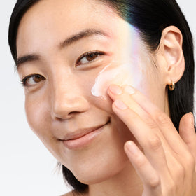 Clinique moisturizer swiped on forearm, shows how it hydrates and evens tone