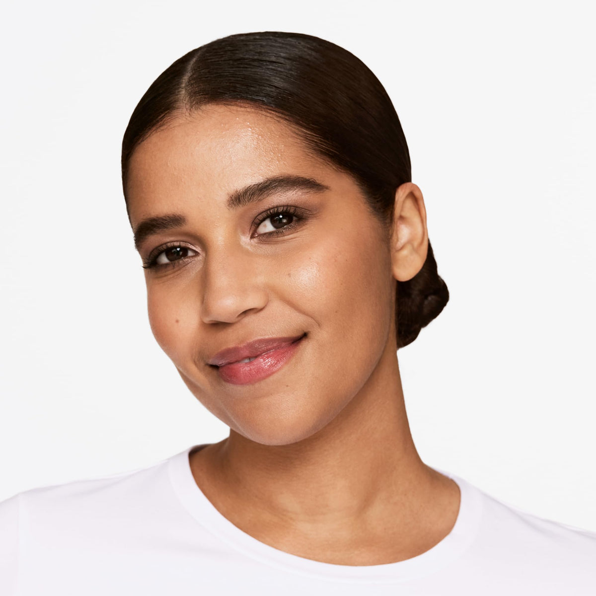 Clinique palette beside lipstick showing size and color-pairing benefit
