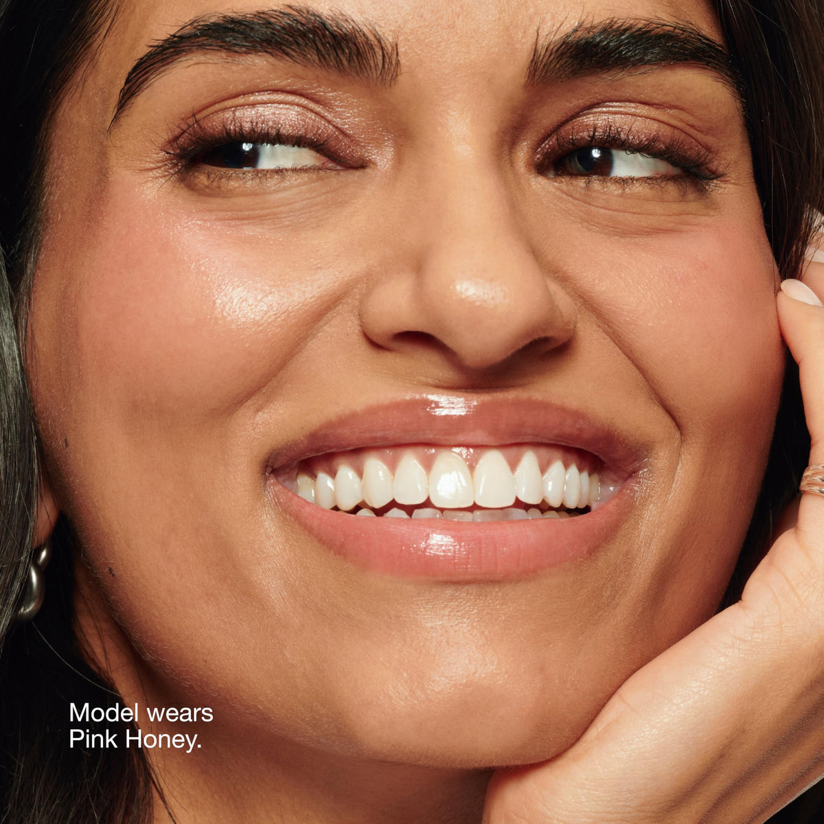 Clinique texture swipe of Pink Honey showing sheer dewy finish and blendable oil benefit