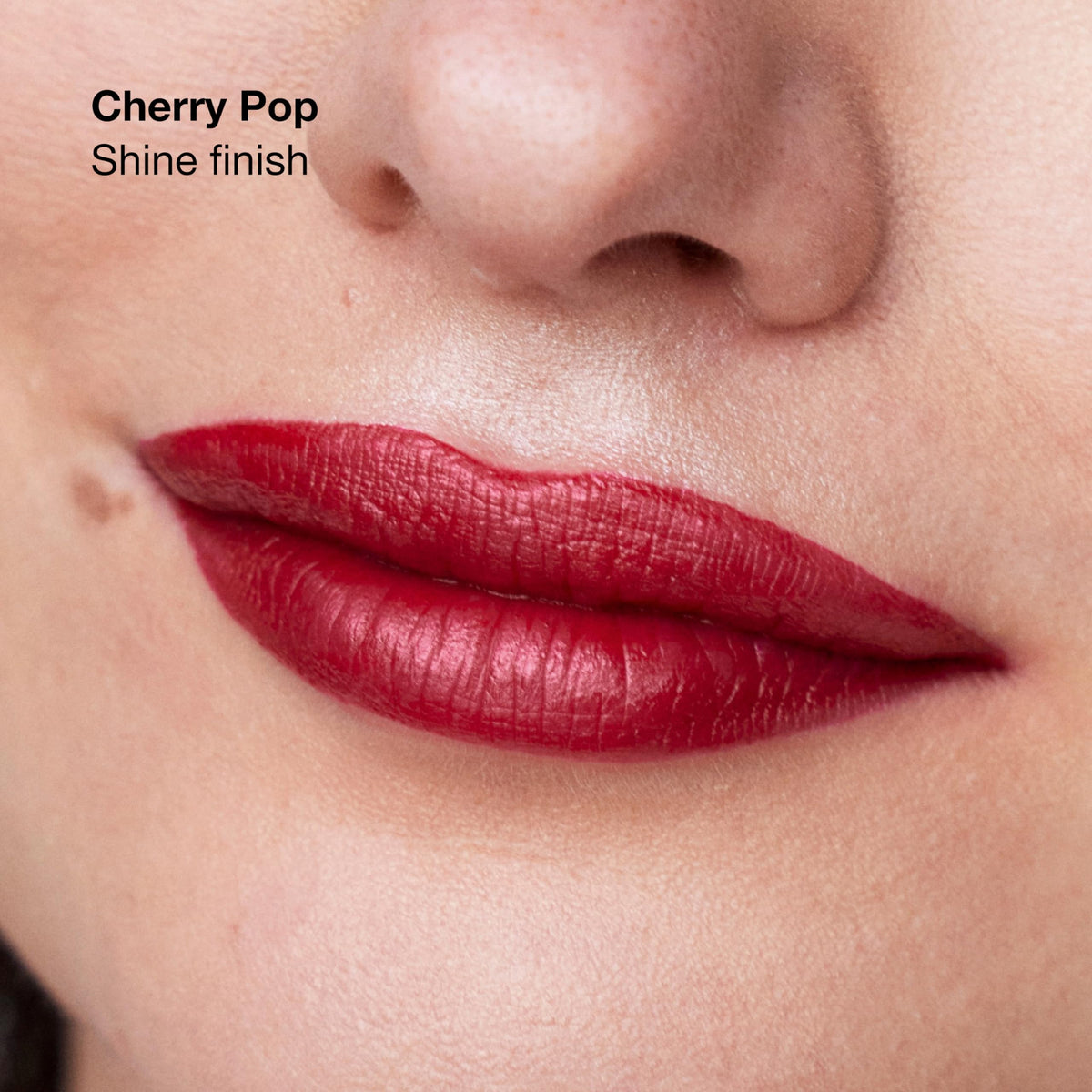 Clinique Pop swatch on arm showing rich pigment and true-to-shade payoff
