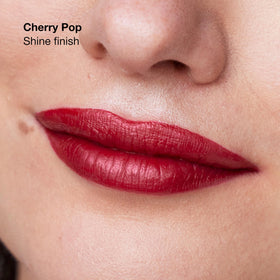 Clinique Pop swatch on arm showing rich pigment and true-to-shade payoff