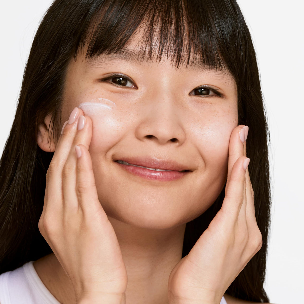 Clinique moisturizer dispensed in hand illustrating easy absorption benefit