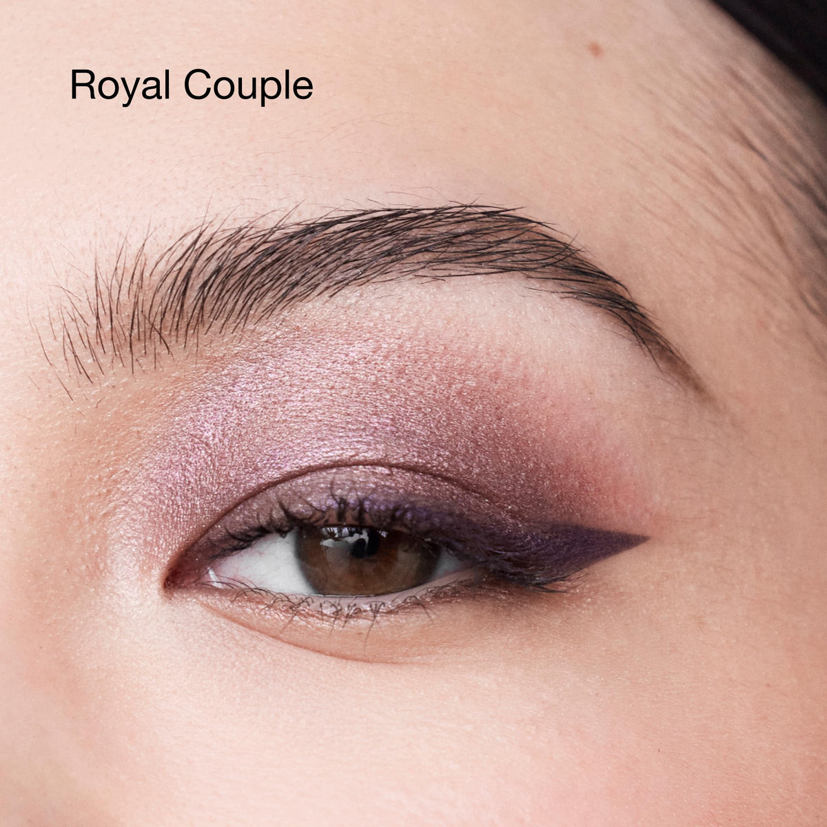 Clinique Royal Couple powder swatch blended on skin showing soft diffusion and buildable depth